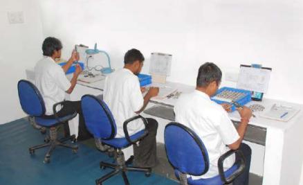 The following image shows workers focusing on product quality